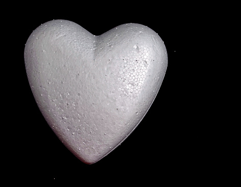White Polystyrene Heart on a Black Background