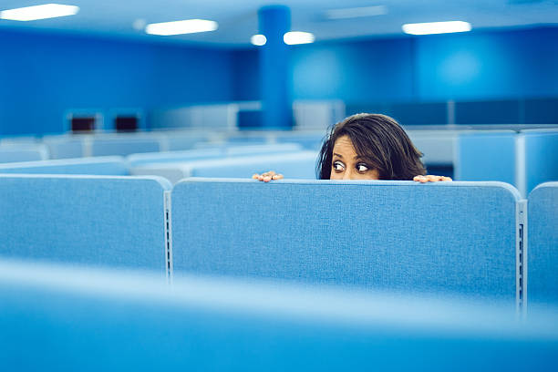 Office Worker Hiding Office worker eavesdropping in cubicle room hiding stock pictures, royalty-free photos & images