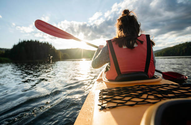 istock Rear view of woman kayaking. 1662335562