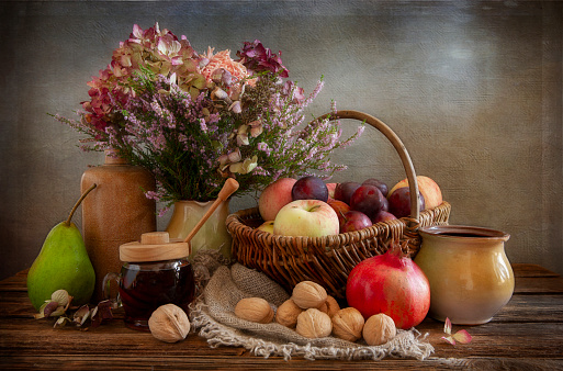 Still life with fruits, nuts and honey in vintage style.