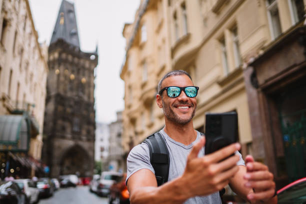 istock Tourist taking a selfie in front of historic monument. 1662435084