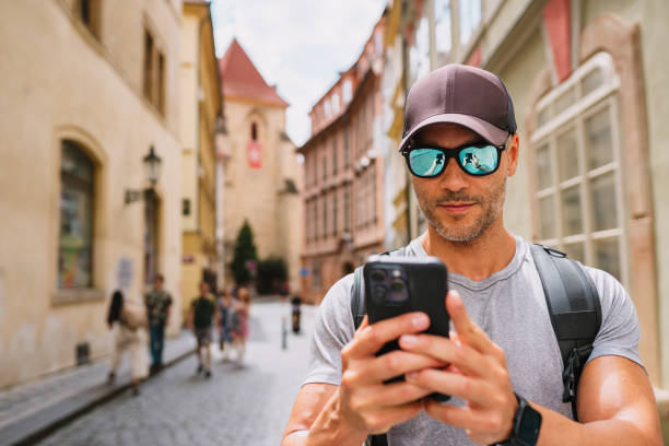 istock Tourist using smartphone to locate during tour. 1662437722