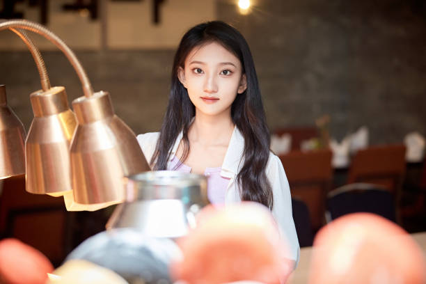 istock A girl eating at a buffet restaurant 1662497546