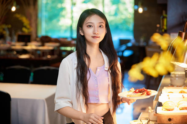 istock A girl eating at a buffet restaurant 1662497550