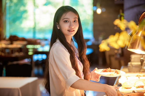 istock A girl eating at a buffet restaurant 1662498072