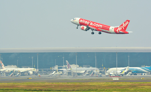 Jakarta, 08/27/2023. A Malaysian Airline (Air Asia) Plane is taking off from one of busiest airport in Indonesia, Soekarno-Hatta International Airport.