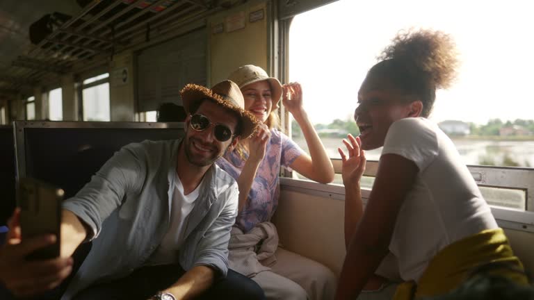 4K Happy Diversity people tourist travel in Thailand on local train.