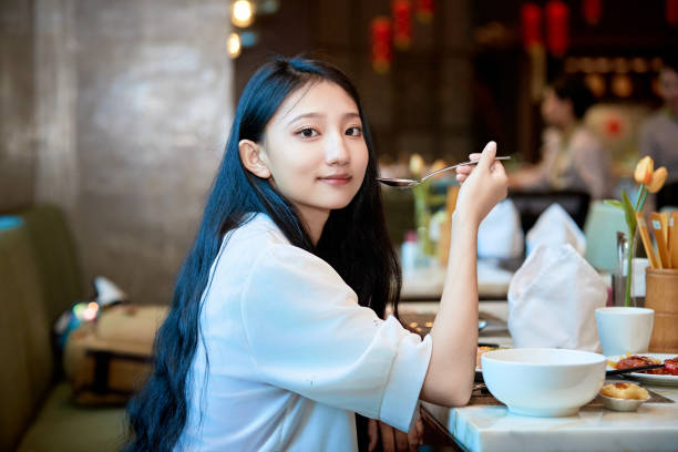 A girl eating at a buffet restaurant