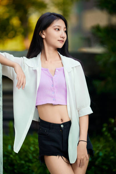 istock A girl taking photos while resting in the yard 1662537788