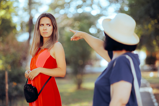 Older woman accusing a girl of being inappropriate