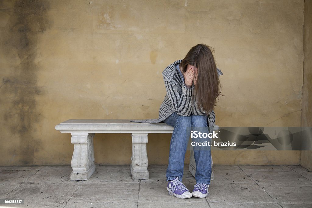Lonely woman crying Lonely woman crying on the bench Adult Stock Photo