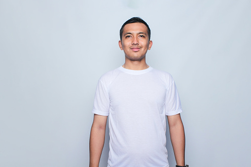 Asian young man wearing white t-shirt for mock up
