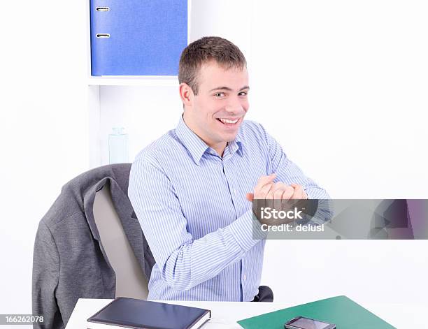 Happy Young Handsome Businessman In His Office Stock Photo - Download Image Now - Agreement, Beautiful People, Business