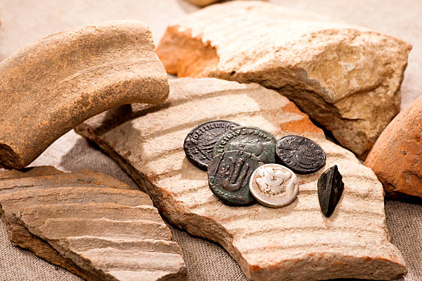 Ancient coins Ancient coins and broken earthenware ancient coins of greece stock pictures, royalty-free photos & images