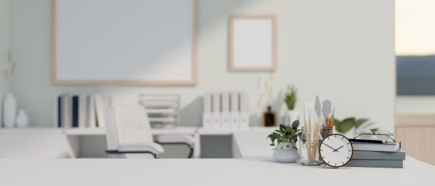 istock A copy space on a white tabletop with office supplies in a modern white office room. 1662672886