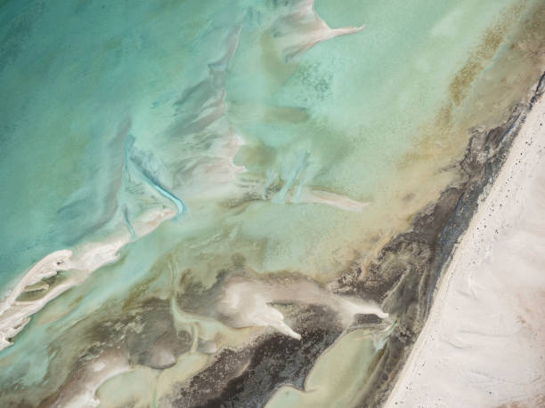 istock Abstract aerial view of sand and water patterns 1662673279