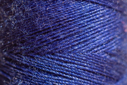 Macro of Blue Thin Thread in Horizontal Orientation.