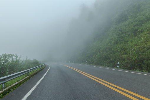Beautiful asphalt road in the foggy.