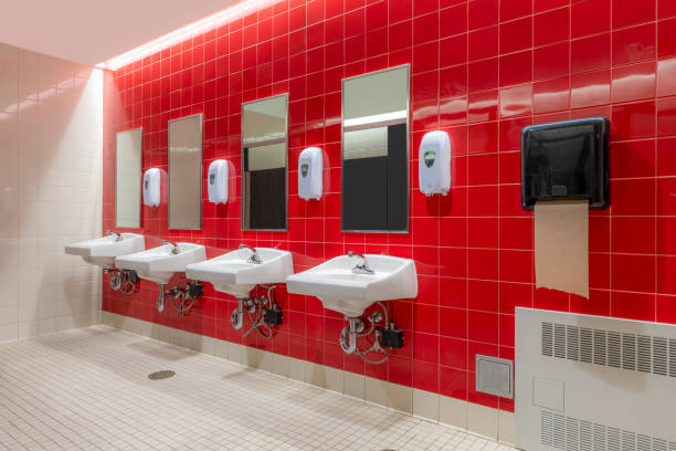 istock Public restroom with red tile and four, lavatories, sinks 1662703865