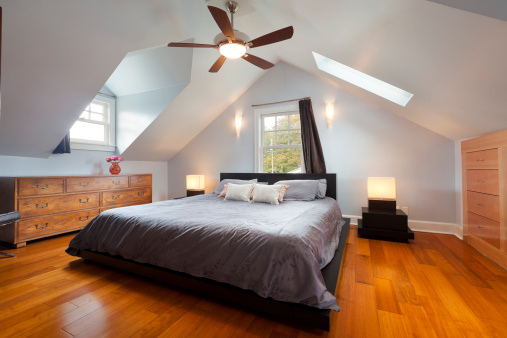 Master bedroom in large attic space.