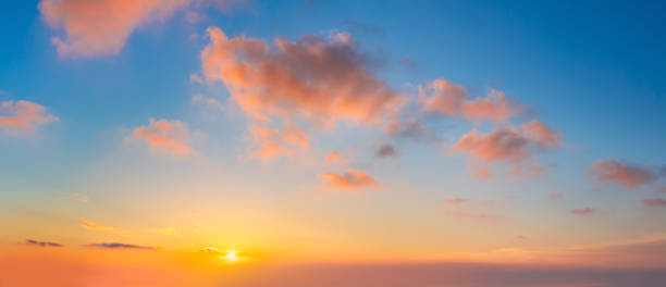 istock Pastel cloudscape. Sunrise sundown sky with light colorful clouds without any birds. With sun. Big size panoramic 1662709217