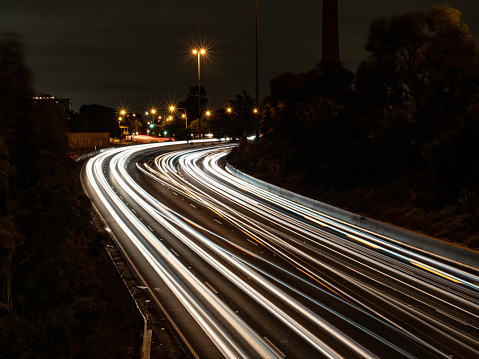 One of Melbourne's multi lane freeways at night with light trails