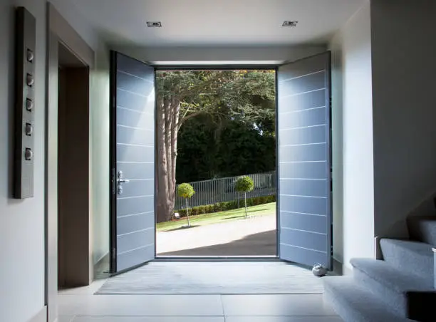 Photo of Front doors and walkway of modern home