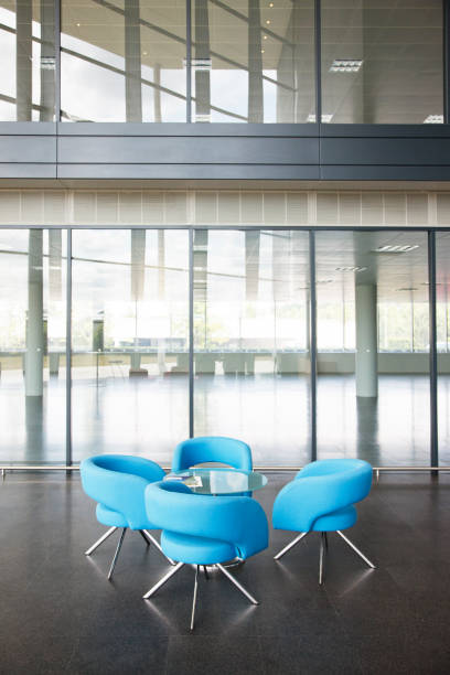 istock Chairs and table in office lobby area 166272439