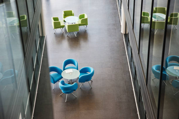 istock Chairs and tables in office lobby area 166272465
