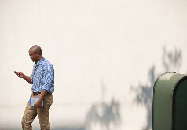istock Businessman using cell phone in urban park 166272489