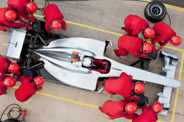 Photo of Racing team working at pit stop