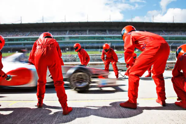 Photo of Racing team working at pit stop