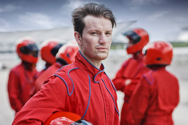 istock Racer holding helmet on track 166272734