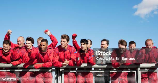 Racing Team Cheering On Sidelines Stock Photo - Download Image Now - Sports Team, Pit Stop, Teamwork