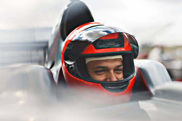 Hoisington, United States - September 4, 2011: Male driver of a demolition derby car mentally prepares for the competition moments before the competition begins.