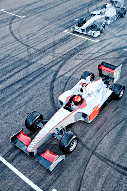 istock Race cars driving on track 166272782