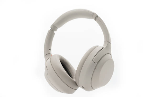 istock Wireless Silver headphones background on isolated background. With Noise Cancelling and Integrated Microphone. 1662728240