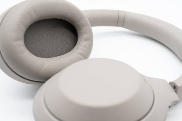 istock Wireless Silver headphones background on isolated background. With Noise Cancelling and Integrated Microphone. 1662728244
