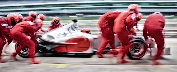 racing team che lavora al pit stop - sports glove protective glove equipment protection foto e immagini stock