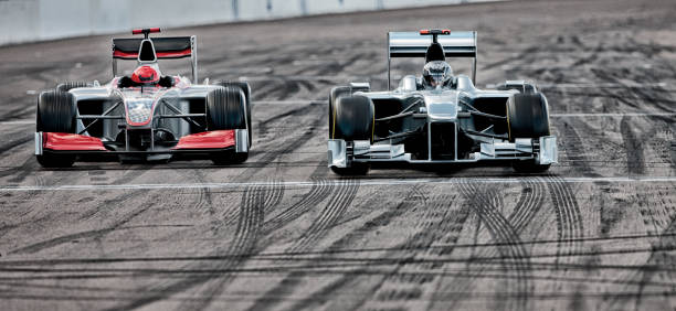 istock Race cars driving on track 166272853