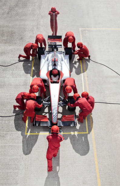 Racing team working at pit stop  sports track photos stock pictures, royalty-free photos & images