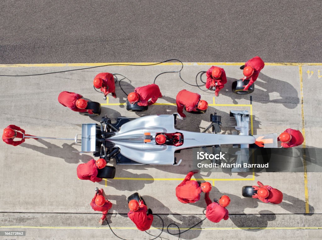Racing team working at pit stop  Pit Stop Stock Photo