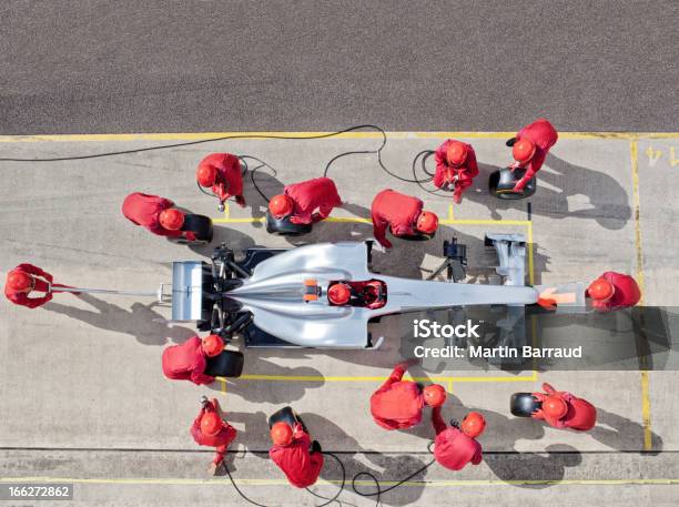 Racing Team Working At Pit Stop Stock Photo - Download Image Now - Pit Stop, High Angle View, Racecar