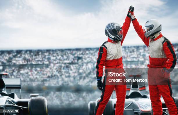 Racers Cheering On Track Stock Photo - Download Image Now - Winning, Racecar, Success