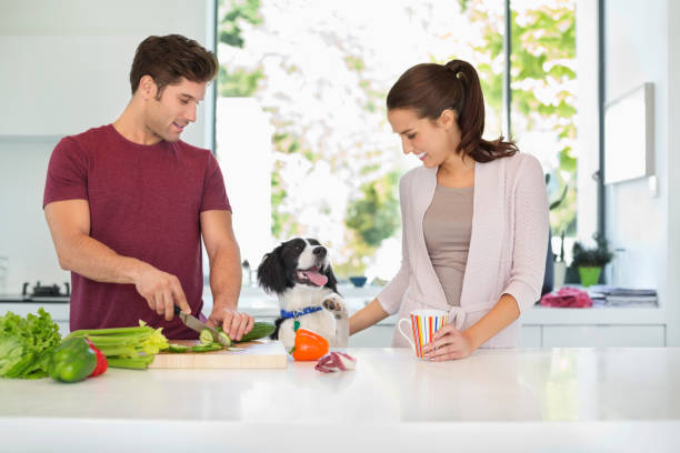 istock Dog with couple cooking in kitchen 166272940