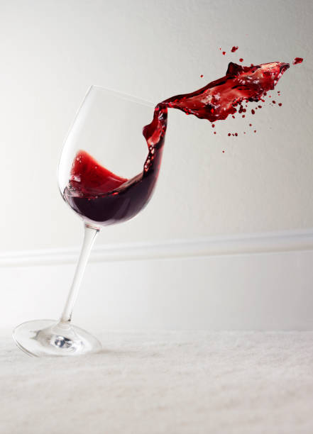 Glass of red wine spilling wine glass knocked over stock pictures, royalty-free photos & images