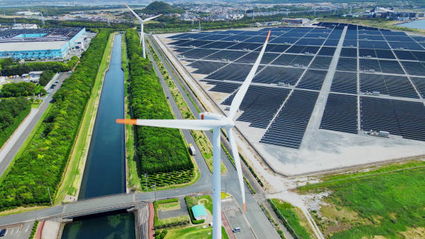 Solar power plant and Windmills aerial view. Renewable energy. Green tech.
