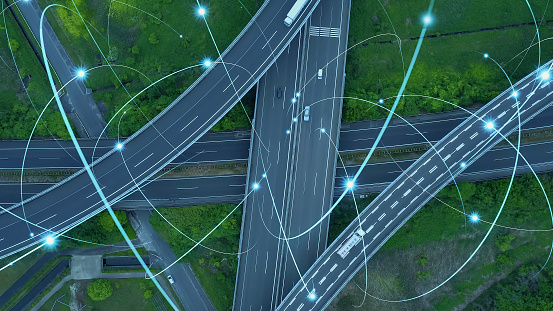 Driving cars oh highway and wireless communication network concept. Aerial view.