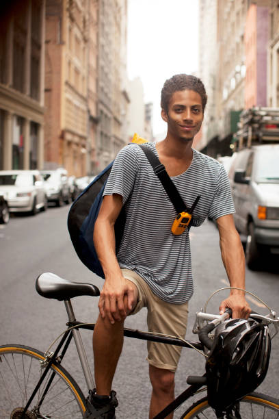 istock Man on bicycle on city street 166273673