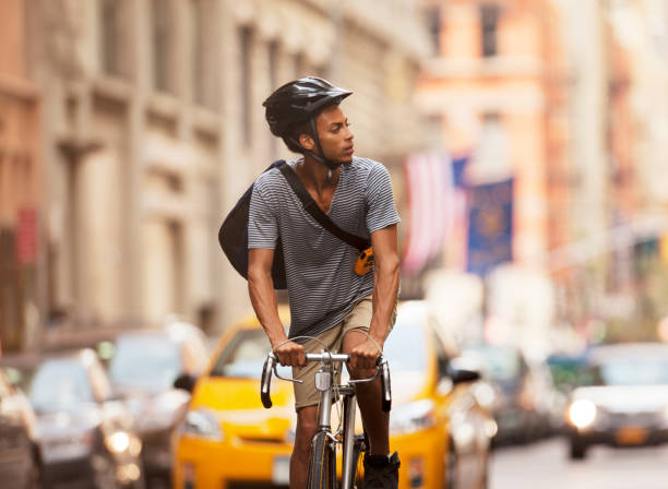 istock Man riding bicycle on city street 166273678